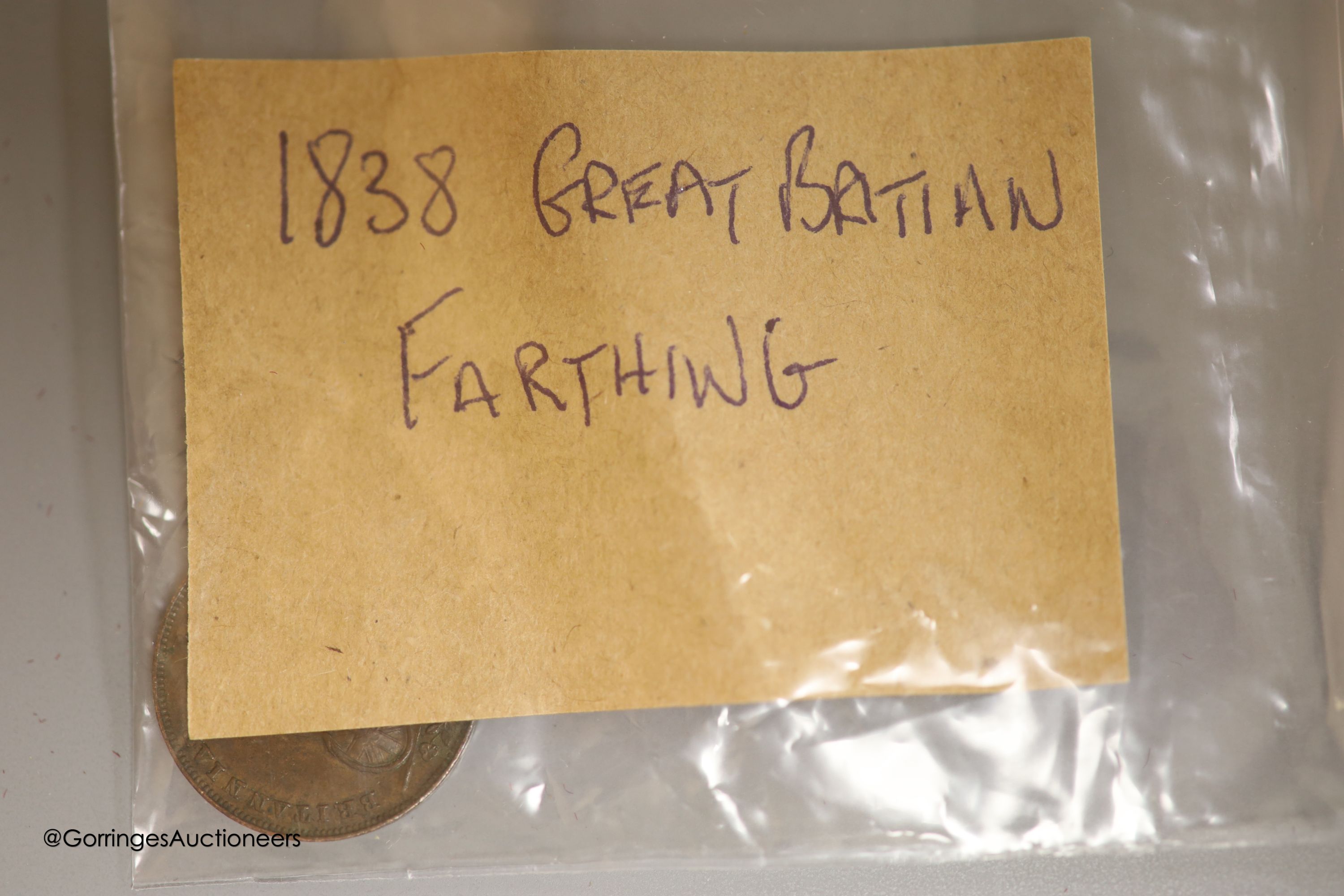 A collection of 18th and 19th century UK and world coins to include: 1834 one penny VF, 1838 farthing AEF, 1855 half penny Good VF, 1826 halfpenny VF and 1848 one penny Good VF